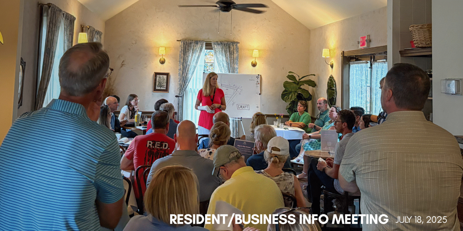 A crowd gathers at a Roswell restaurant to listen to a public information meeting.